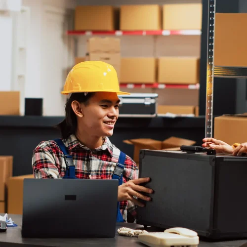 asian-person-checking-warehouse-supplies-from-shelves-using-supply-chain-production-work-inventory-laptop-young-man-planning-shipment-startup-business-development